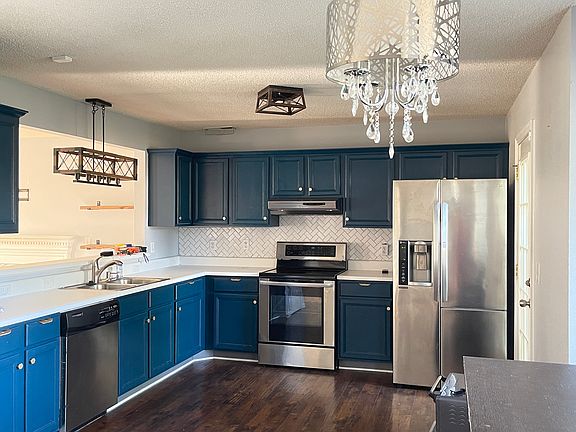 New light fixtures, backsplash, painted cabinets. Fridge has ice maker and a "cold saver" door