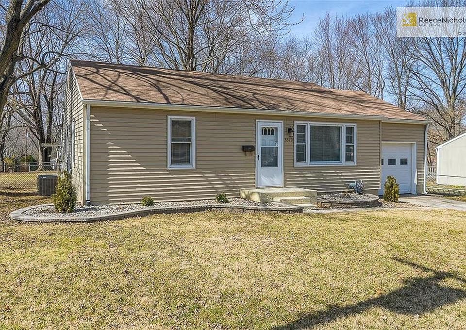 Nicely landscaped front of home with great curb appeal.