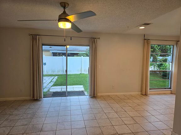 living room with the window from the dine-in kitchen