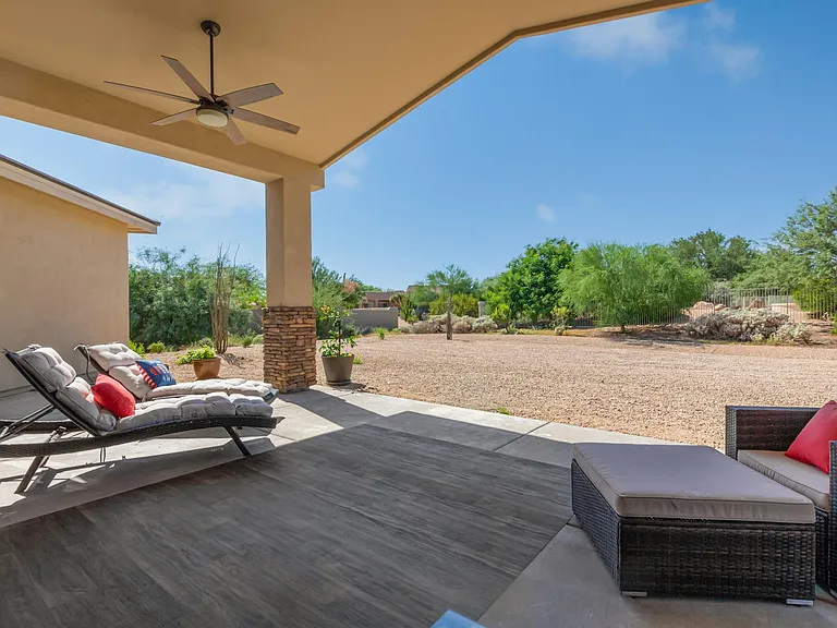 COVERED PATIO, SW FACING BACKYARD.