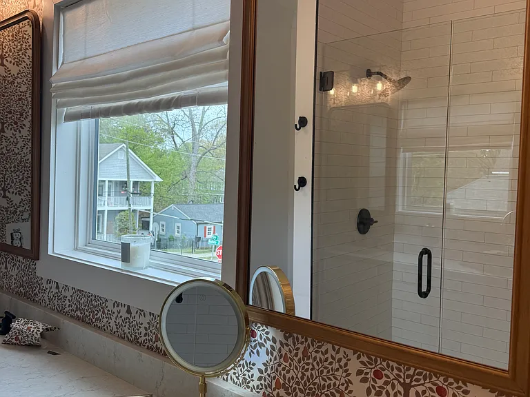 primary bathroom with double sinks and large walk in shower