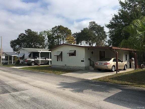 Front of Home w/ Attached Carport