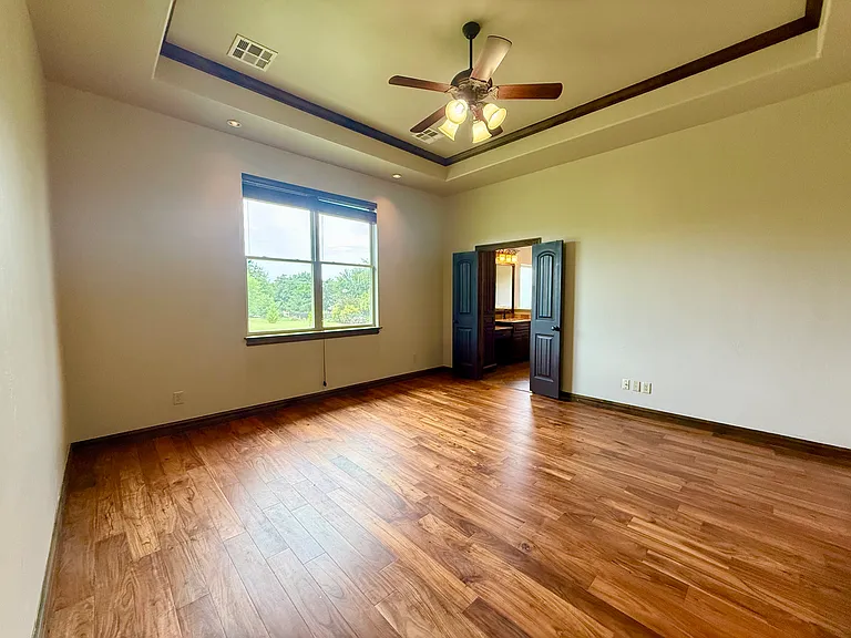 Master bedroom sits on the west side of the house. It has hard Acacia floors; layer lighting allows for different light ambiance based on your needs and large windows for natural lighting. Double doors lead you into an amazing Master Bathroom.