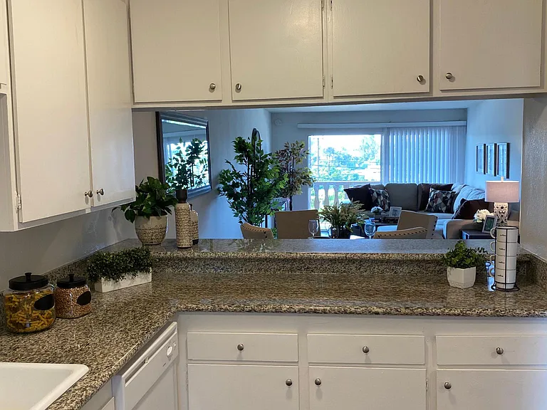 2 Bed - Kitchen overseeing dining room and living room