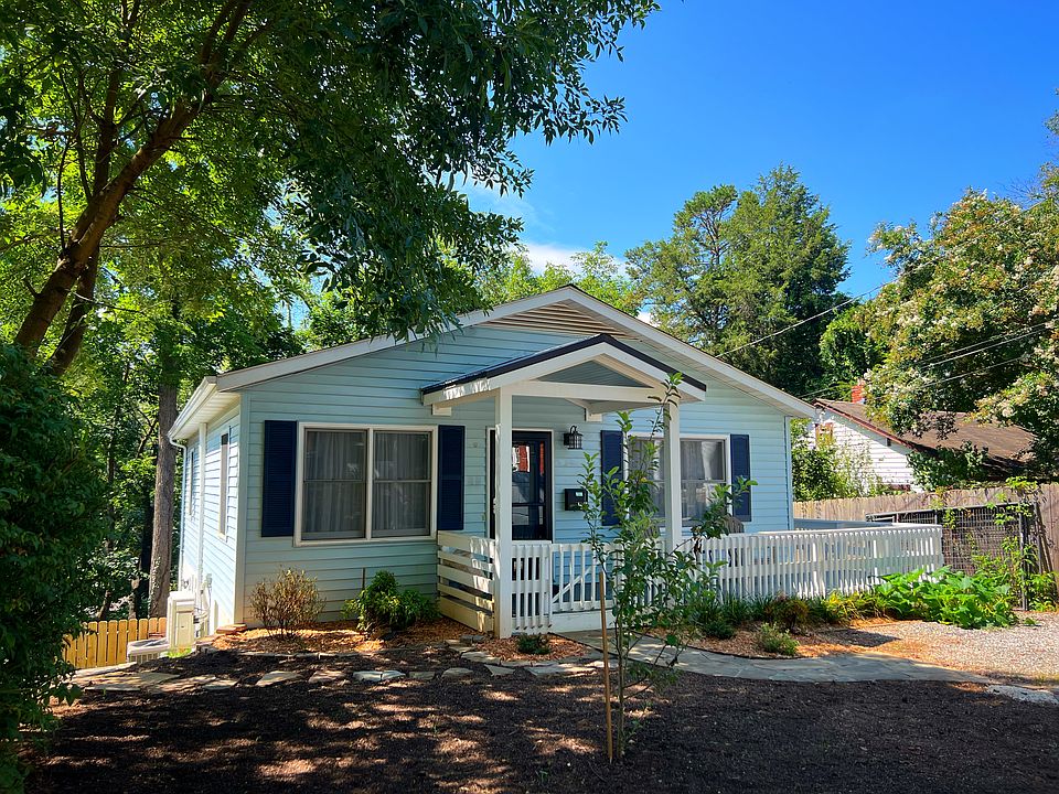 Front of house (front yard recently sodded with clover)