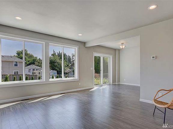 Throughout this home you  will notice the over-sized windows letting in abundant natural light. The living room leads to the dinning area and access to the spacious back yard and patio. 