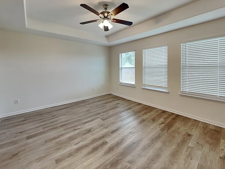 Spacious bedroom with neutral