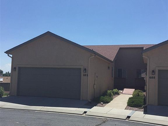 Stucco.  Plenty of off street parking throughout the complex