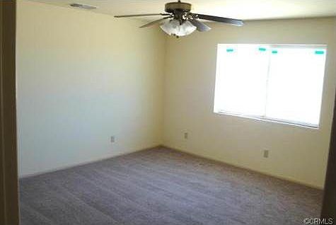 Large mirrored closet doors. Ceiling fans in all bedrooms