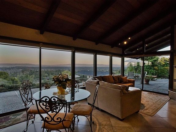 looking from kitchen to casual dining area and family room.