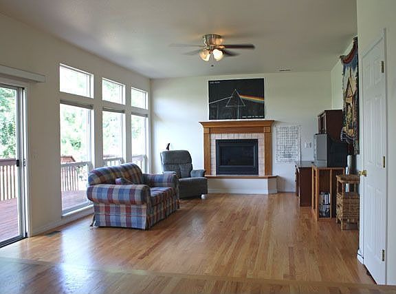 Family Room w/wall of windows, FP, Wood floors