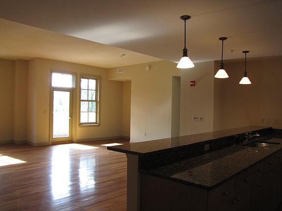 Just inside the from door.