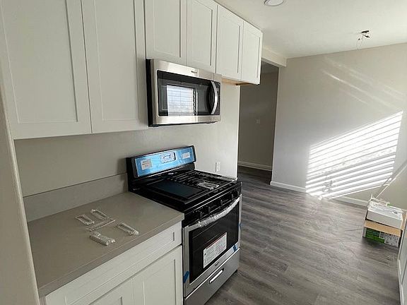 Kitchen and dining area. Fridge not provided.