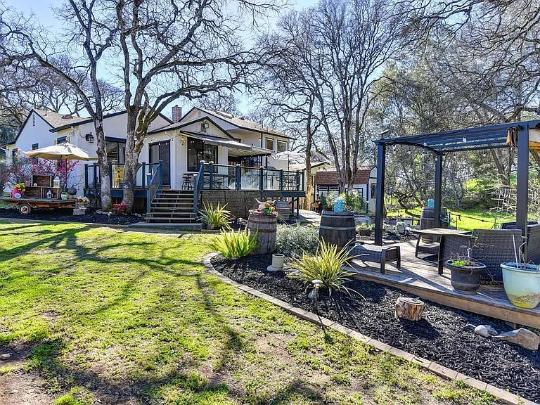 A view of the backyard, which you will have access to, and the adjacent house.