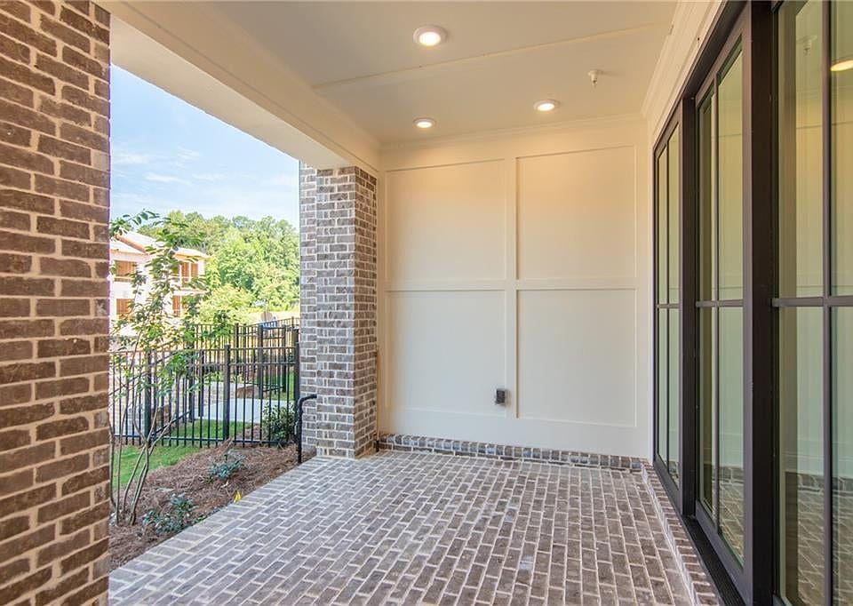 Covered patio with sliding doors leading to media room. Stock photos used for demonstrational purpo
