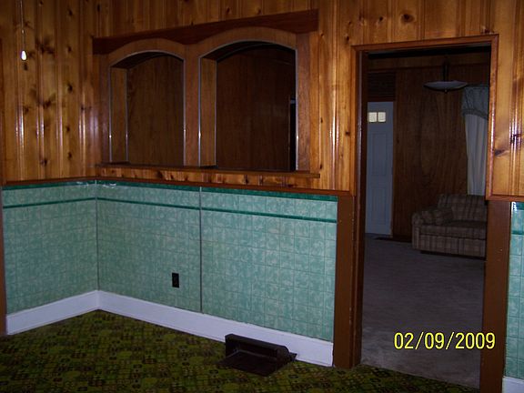 Eat in kitchen with knotty pine style walls