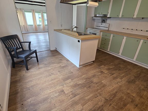 kitchen with island; new paint, new floor, new stove
