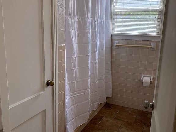 Shared hall bathroom. Full bath with plenty of storage.