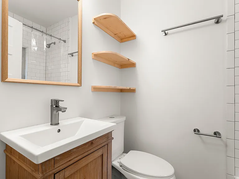 Full bathroom has tub and shower