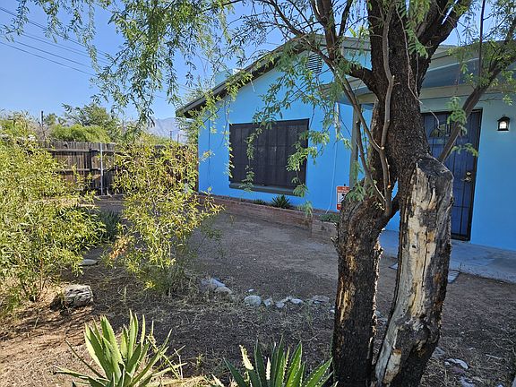 The blue section of the home is the 3 bedroom with private backyard.