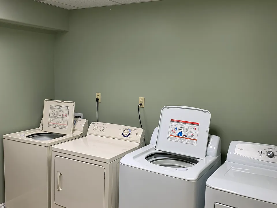 Free laundry on same floor as apartments, shared by 4 tenants and cleaned weekly.