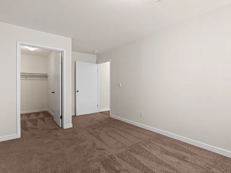 Comfortable bedroom with soft carpeting, generous closet space, and a versatile layout designed for everyday living. Comfortable bedroom with soft carpeting, generous closet space, and a versatile layout designed for everyday living.