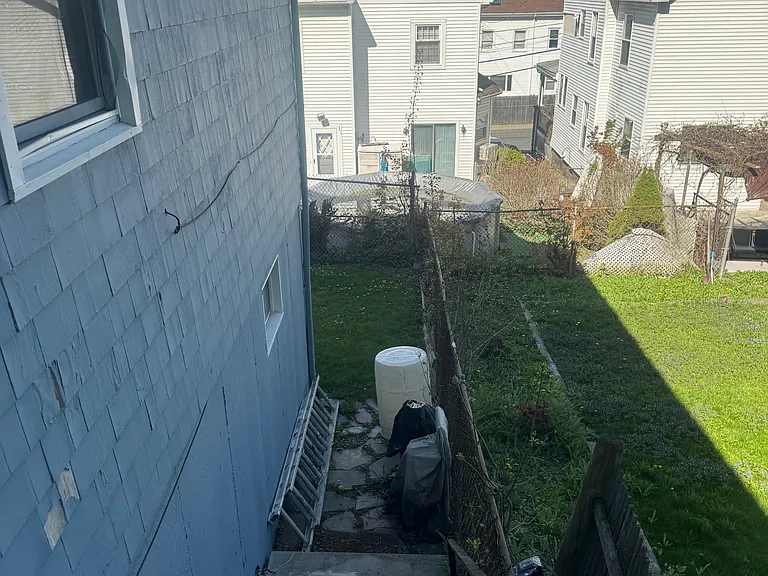 STAIRWELL TO BACK YARD