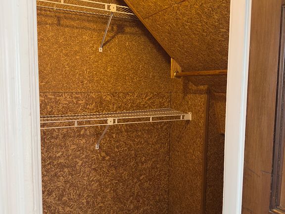 Cedar closet with shelving for storage.
