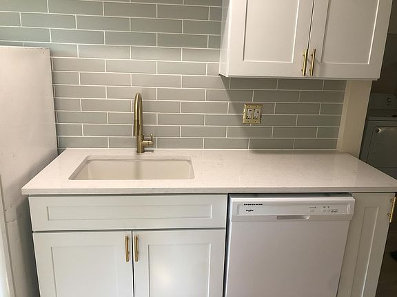 New Kitchen! New flooring, cabinets, paint, sink, quartz countertop, backsplash, faucet.