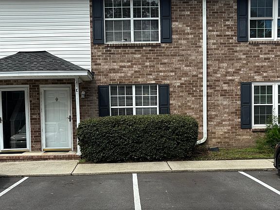 Front of unit, with 2 designated parking spaces
