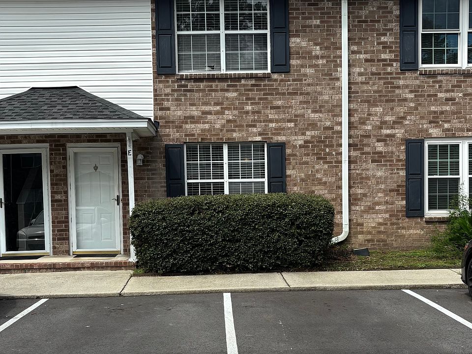 Front of unit, with 2 designated parking spaces