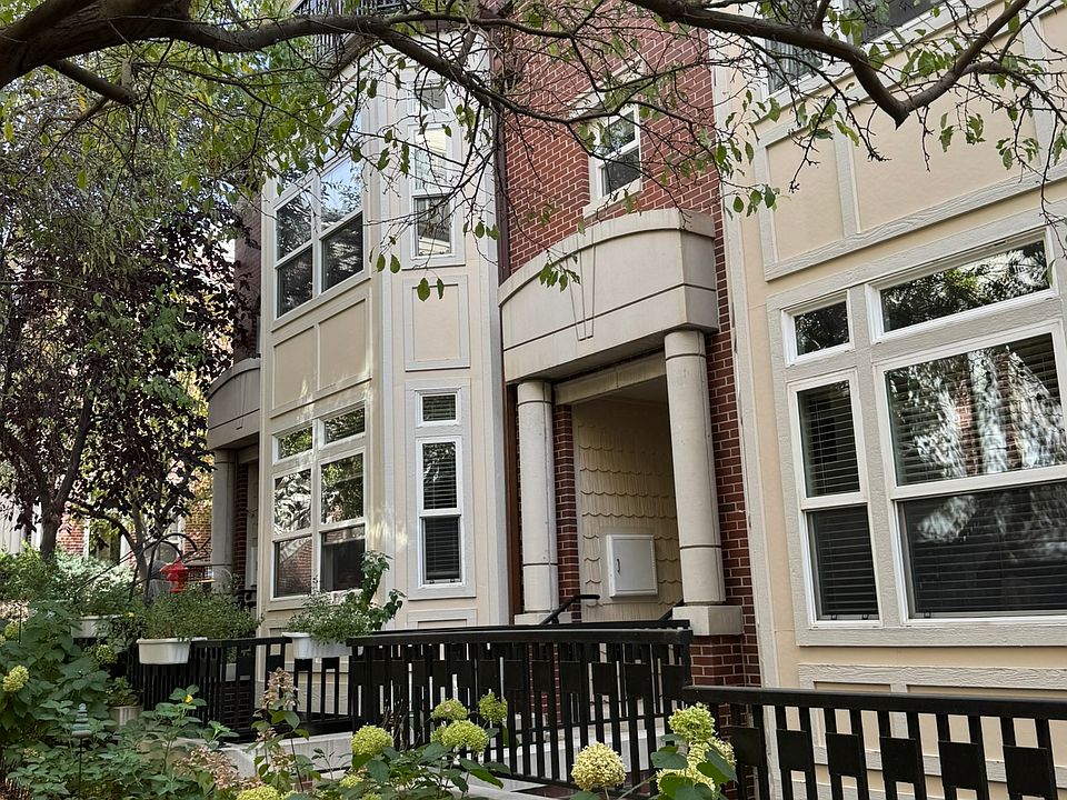 Main entry. Quiet and secluded location. Private attached one car garage in the rear with direct access into the unit. Central heating and air, plus fireplace, high ceilings, and hardwood floors.