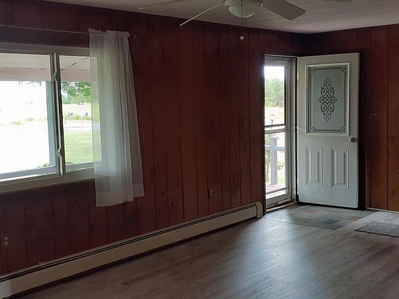 FROM END OF LIVING ROOM TO FRONT DOOR