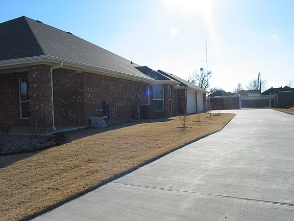 LONG DRIVEWAY WITH 4 AND 1/2 GARAGE WITH HEAT AND WATER IN 2CAR GARAGE SECTION WHICH CAN BE USED AS SHOP OR EFFICIENCY OR GAMEROOM