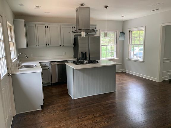 Kitchen and island (back door on left)