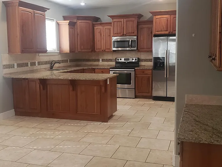 Generous dining, desk and kitchen area.