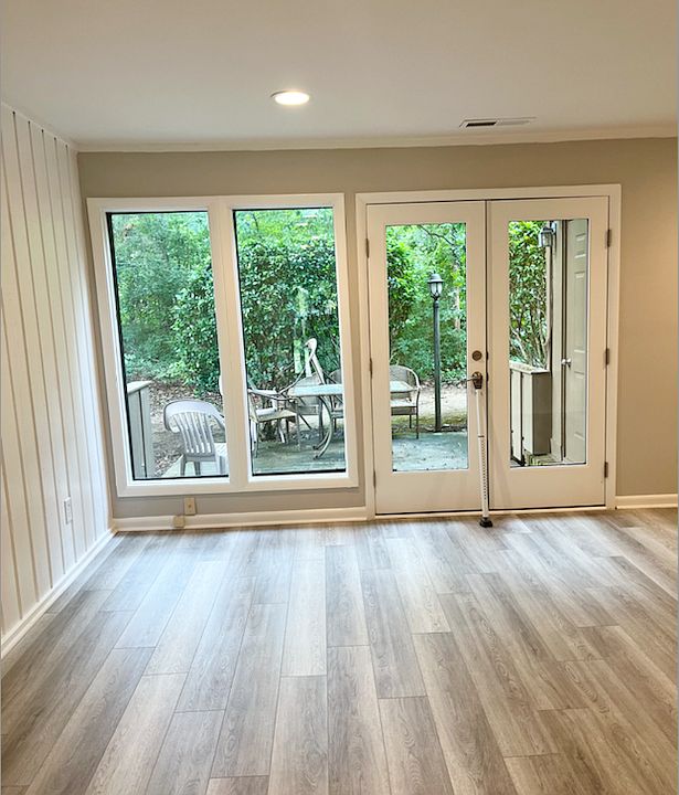 Great Room with natural light to outdoor patio and storage