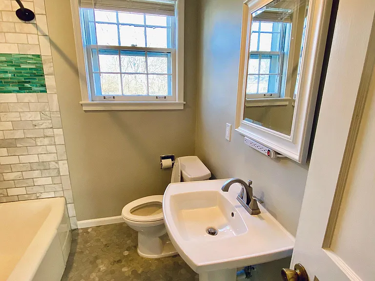 Full bathroom - completely redone with new tile, fixtures, sink and commode