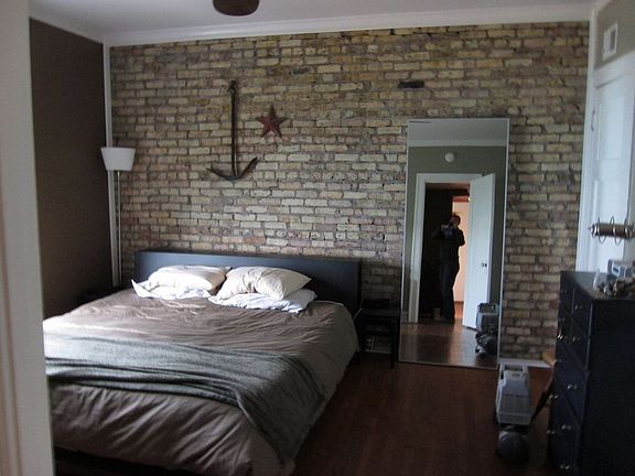 exposed brick bedroom