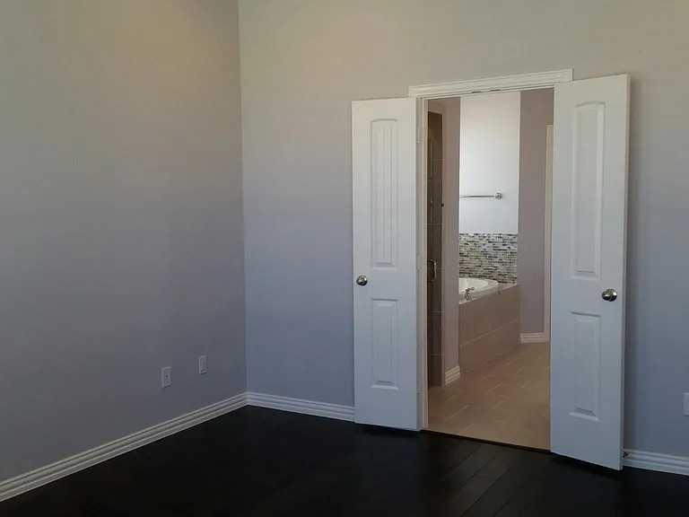 Master Bedroom with en suite bathroom complete with separate shower and tub.