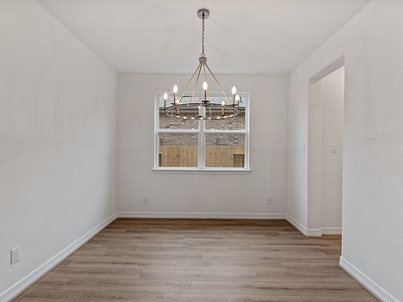 The dining area is a perfect blend of style and functionality, providing an inviting space for memor