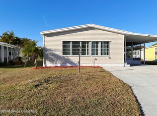 606 Dolphin Cir, Barefoot Bay, FL 32976