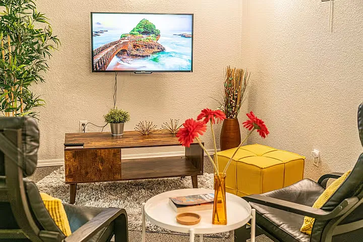 Large living room #2 with two comfortable lounge chairs and a smart TV