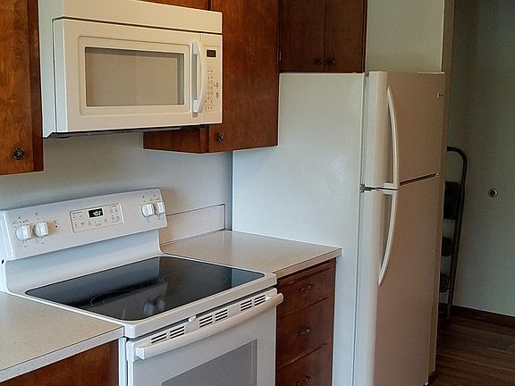All New: Glass top Stove, Microwave Over Range & Refrigerator