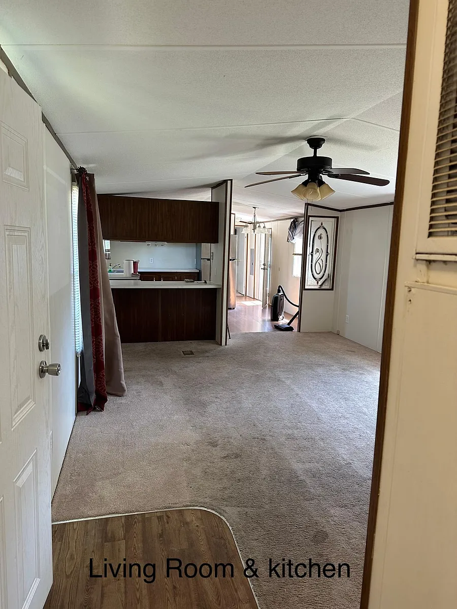 View from the 2nd bedroom area, looking into the living room and Kitchen - 150 Swan Point Rd