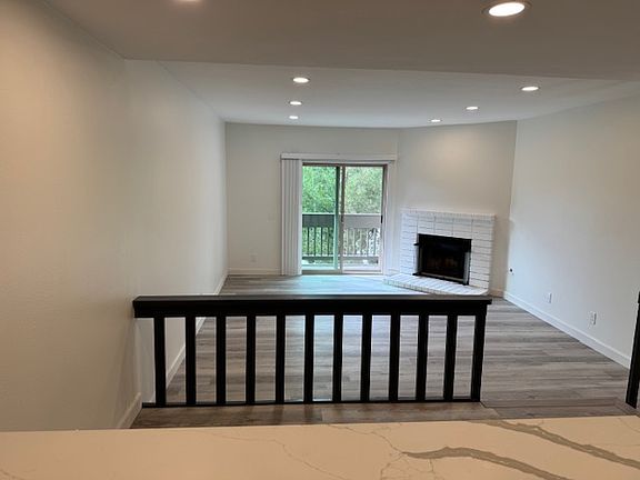 Look over the dining/living area and balcony from your open kitchen