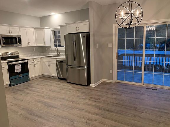 Kitchen/Dining with sliders out to private deck