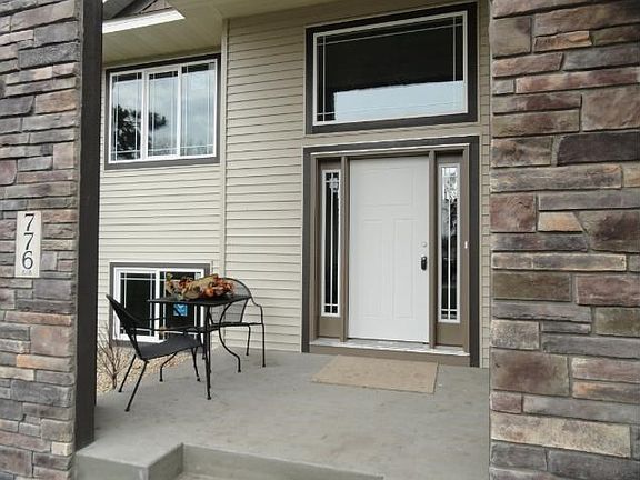 Beautiful front entry with porch space!  Purchase this home or we can build your dream home!!! Check out all of our standard features.  Lots in this neighborhood and also on 100th court in Spring Lake Park school district!