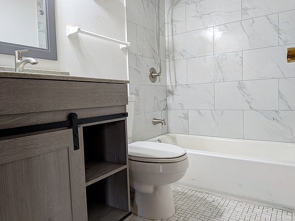 Another view of the main bath with a new stylish vanity