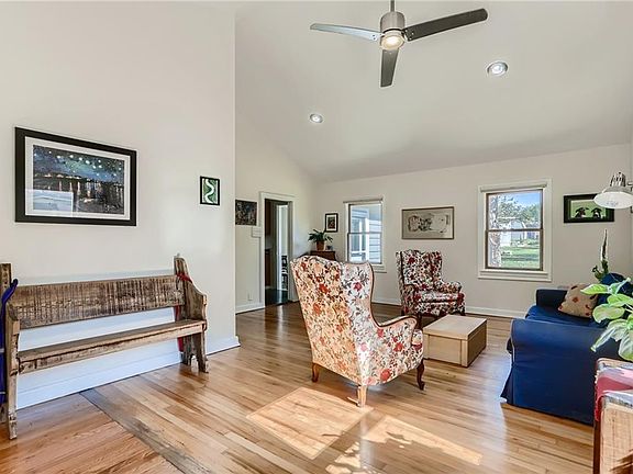 LARGE LIVING WITH VAULTED CEILINGS AND HARDWOOD FLOORS LOTS OF LIGHT